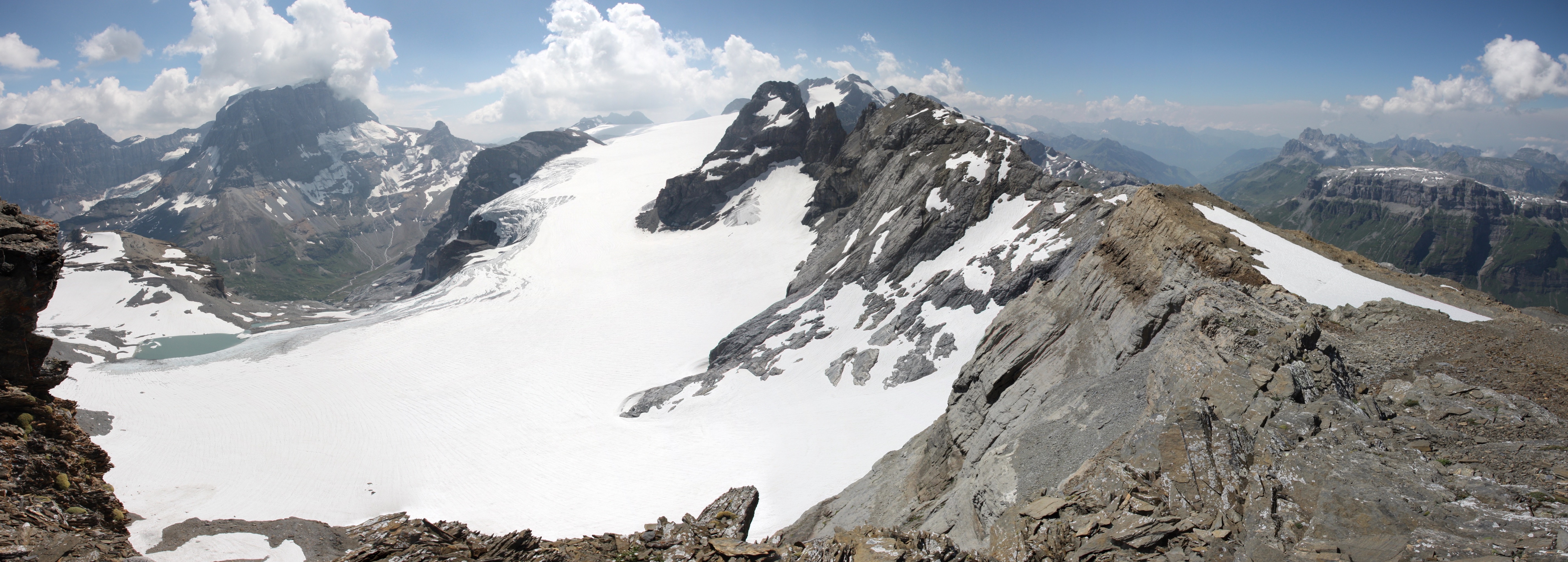 A panorama from the ridge below the peak of Gemsfairenstock. The distant mountain is Tödi (the highest mountain in the Glarus Alps). The large expanse of snow and ice in the centre is the Claridenfirn glacier (which has been subject to the longest continuous time series of mass balance measurements of any glacier in the world) and to the right in the distance is the Urnerboden valley where we started our hike in the morning.