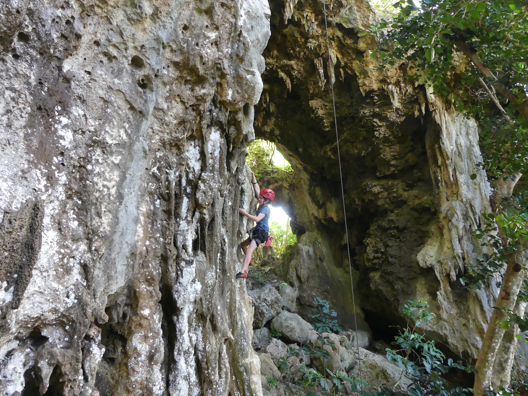 Aiden climbing Faka'ofa'ofa (grade 14) at Houma Tahi cave.