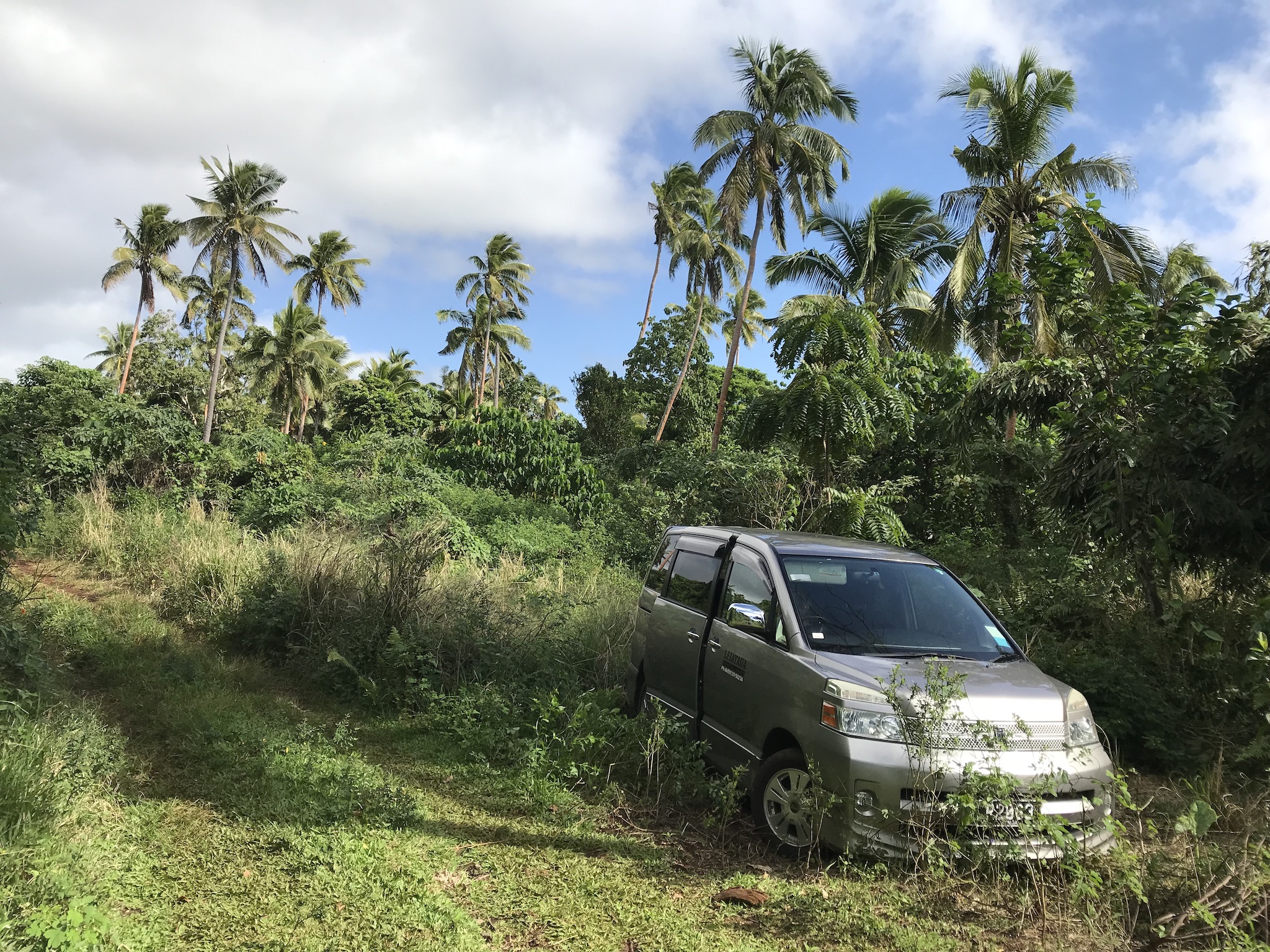 Our '4WD' rental car, parked as near as we dare to Houma Tahi beach. As it turned out, the hike to the beach took us nearly an hour.