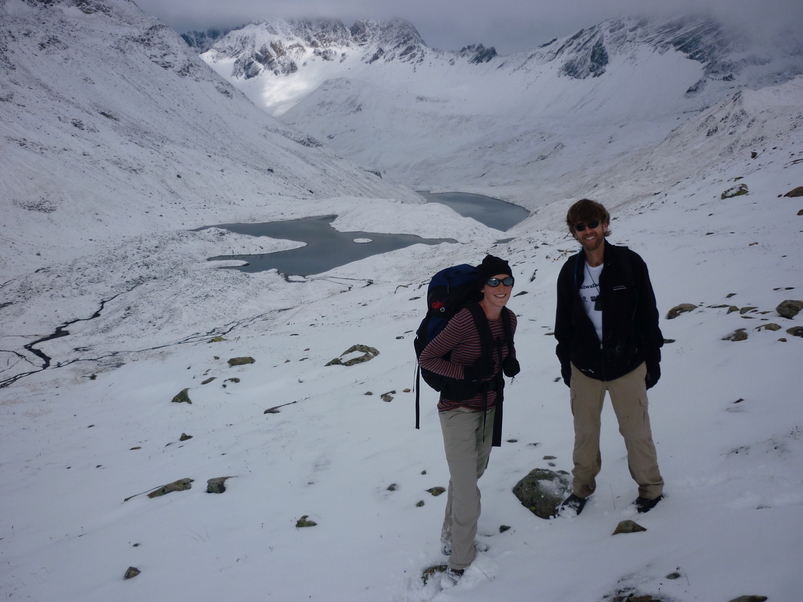 Tanja and Quentin nearing Sertigpass with the Lai da Ravais-ch in the background.