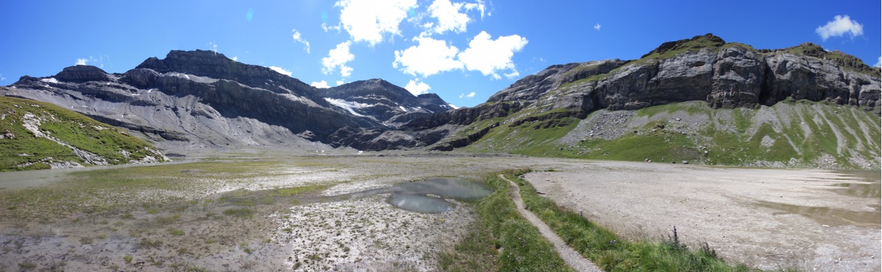 The approach to Lämmerenhütte crosses a wide open gravel riverbed landscape.