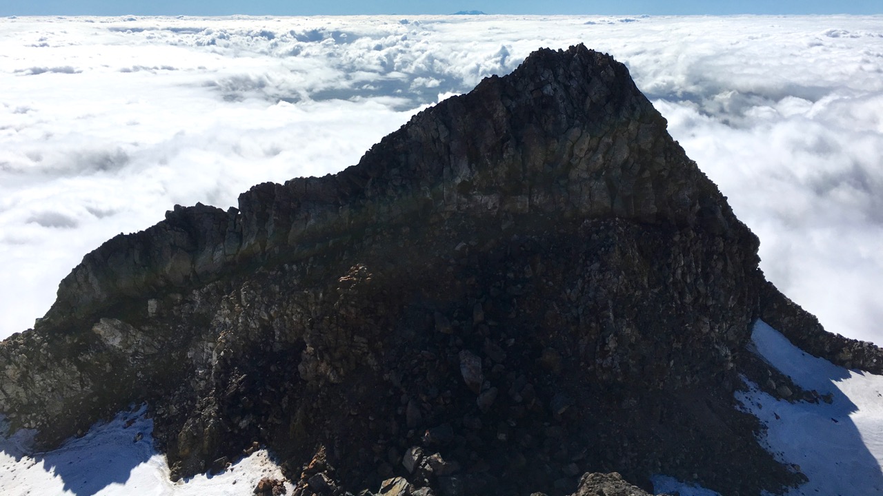 The Shark's Tooth (2510m) on the other side of the crater is just 8 metres lower than the peak.