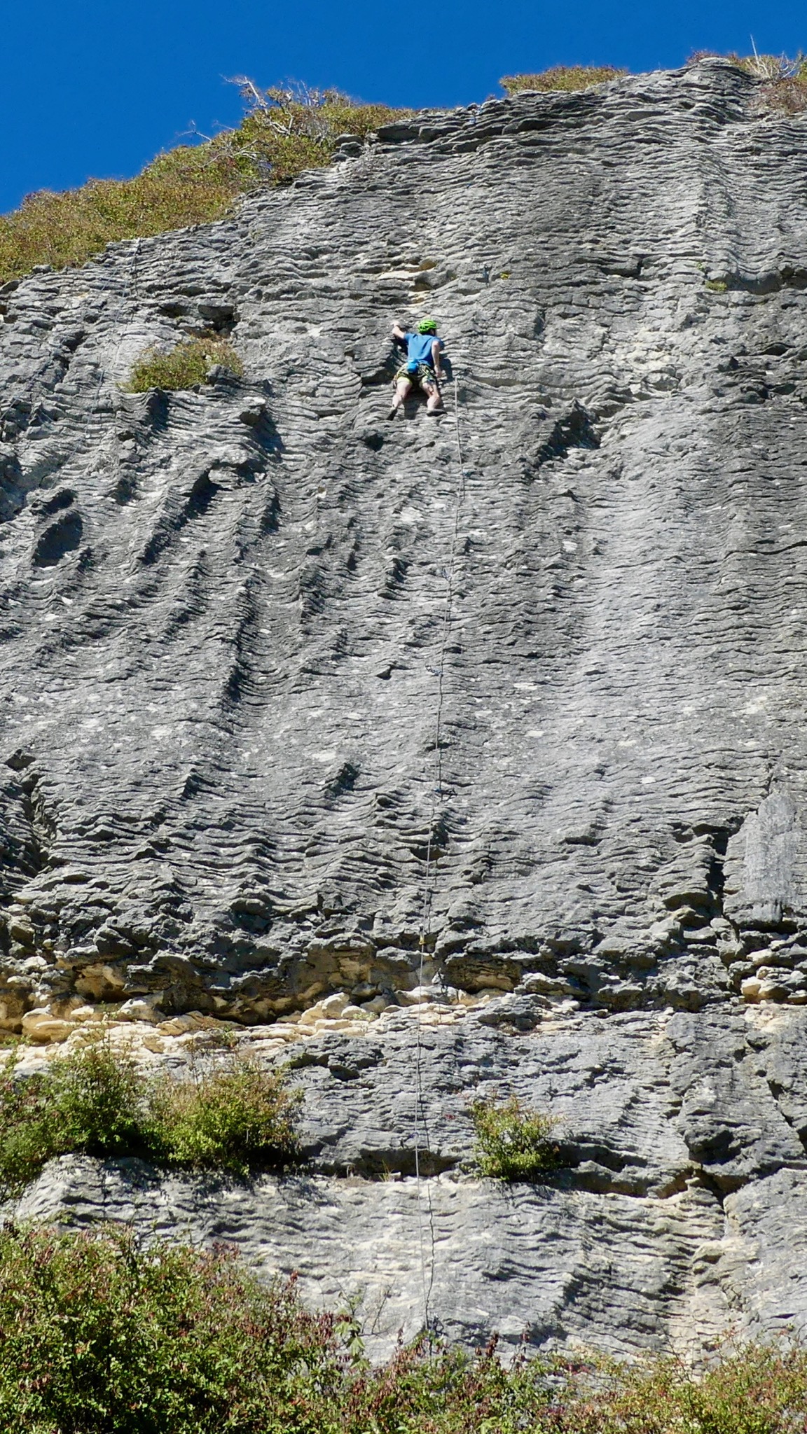Alexei lead-climbing Marisol (grade 17) route on the Cathedral wall at Pohara.