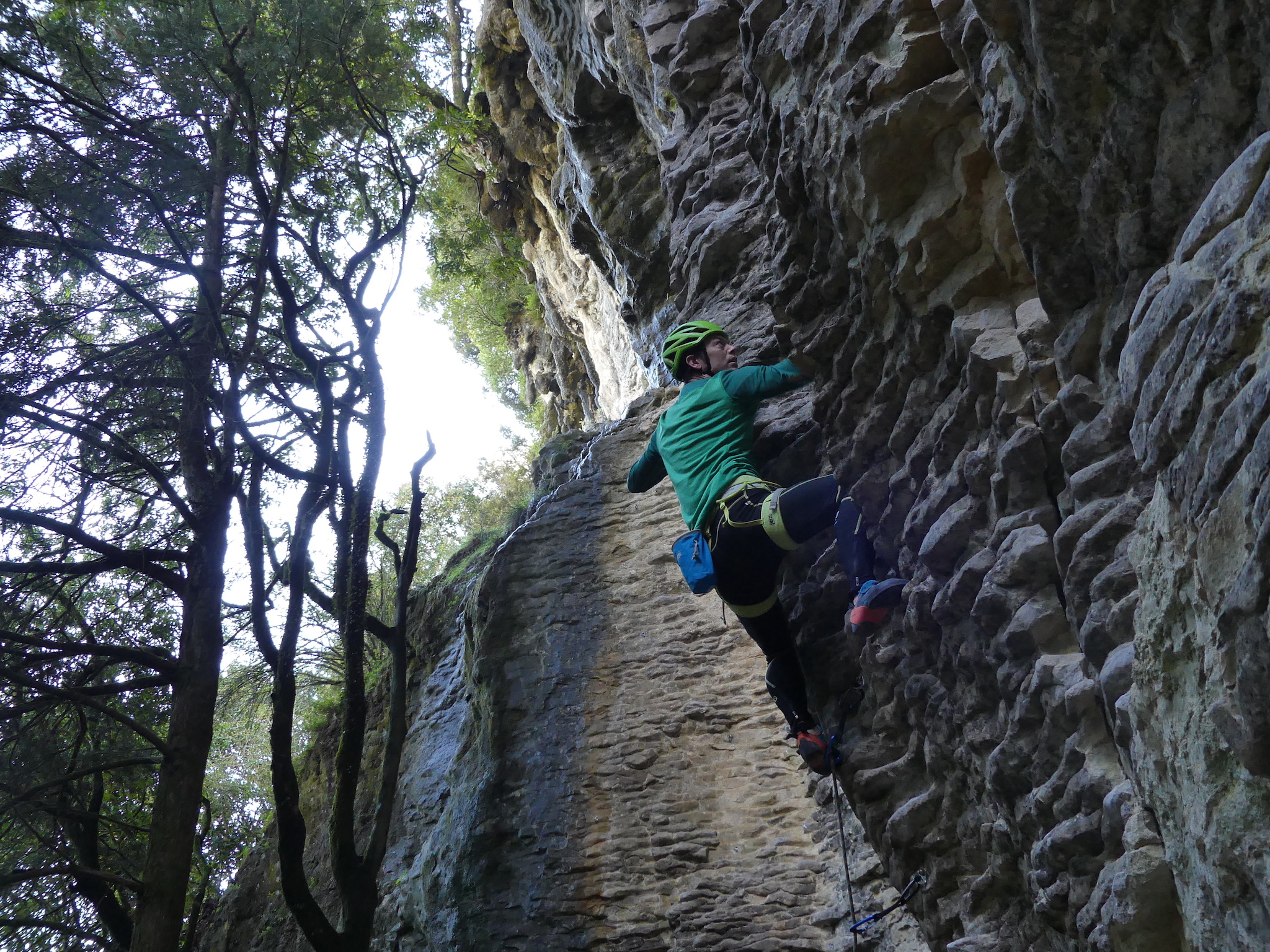 Alexei moving up to the fourth bolt of When Cavers Go Climbing (grade 21) in the Colosseum at Mangaokewa, on first attempt of the day.